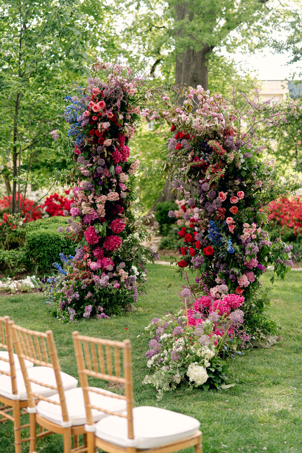 colorful floral ceremony arch for jewel toned meridian house wedding