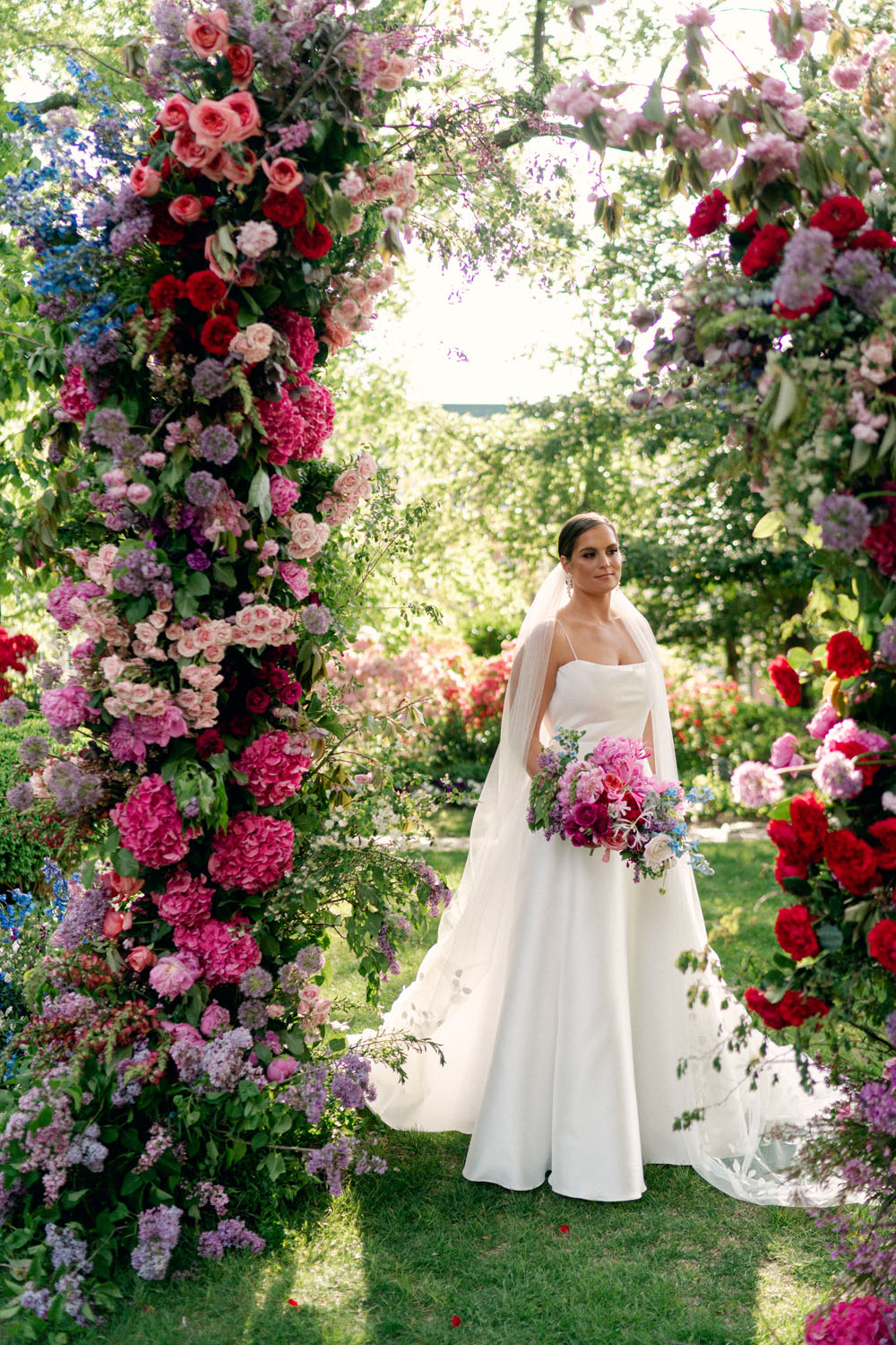 gorgeous floral arch at jewel toned meridian house wedding